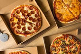 Pizza boxes with different pizza in each of them - La Pizza Hub