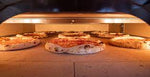 VIEW OF 6 PIZZE IN COOKING CHAMBER MORETTI NEAPOLIS PIZZA OVEN - La Pizza Hub