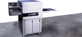 Stainless steel conveyor oven on stand with 'Moretti Forni' branding on a concrete floor - La Pizza Hub