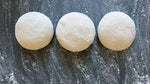 View from the top of three perfectly equal frozen Neapolitan pizza dough balls - La Pizza Hub